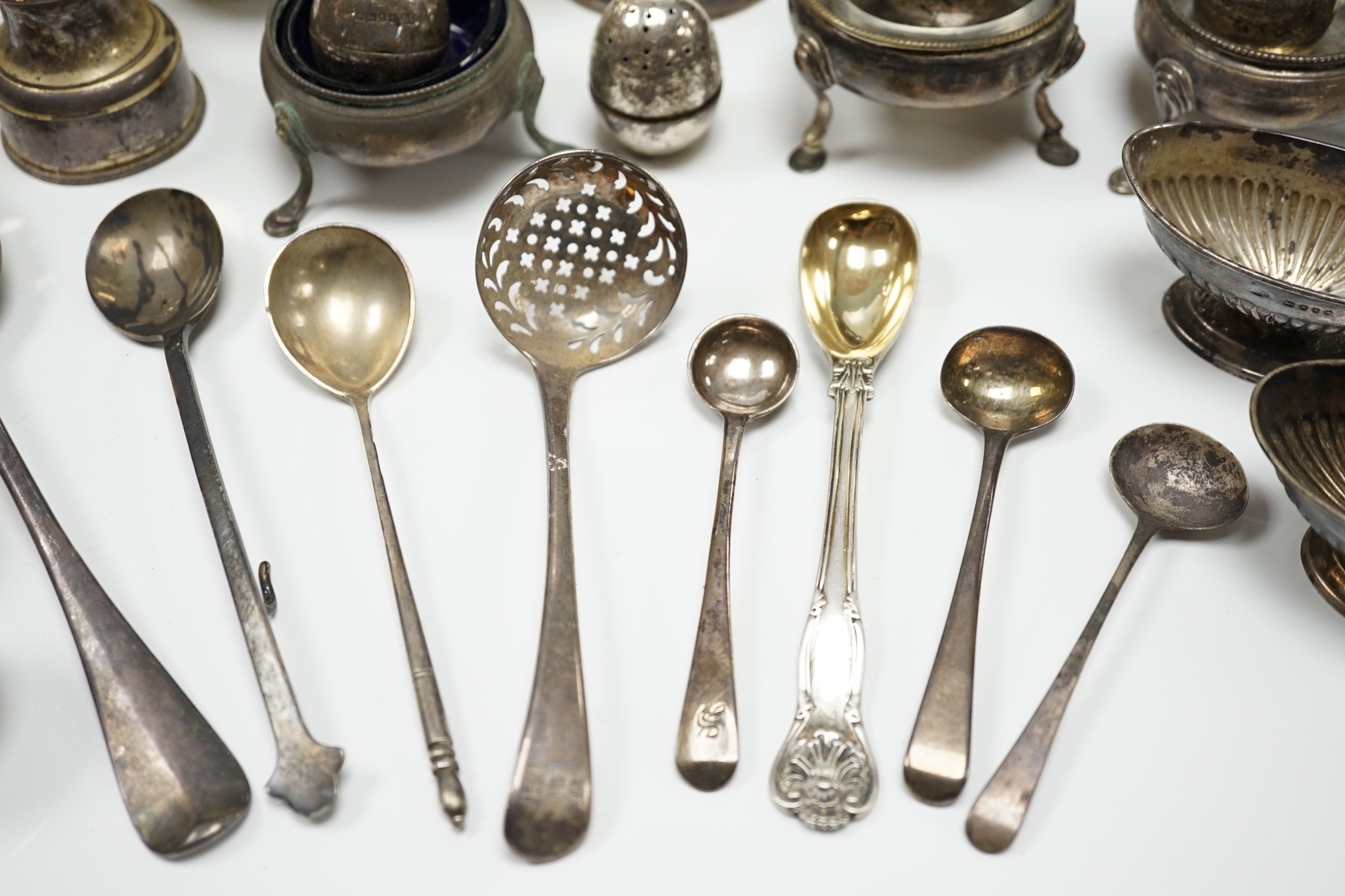 Sundry small silver including a Guernsey can milk jug, mustard pot, damaged mounted glass hip flask, flatware and minor plated wares.